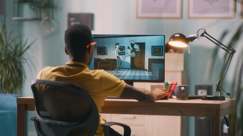 Man creating 3D cartoon on computer