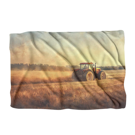 Couverture de tracteur au coucher du soleil